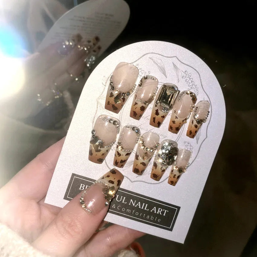 Leopard print plastic wearable nail armour set with advanced flash finish on women's hands