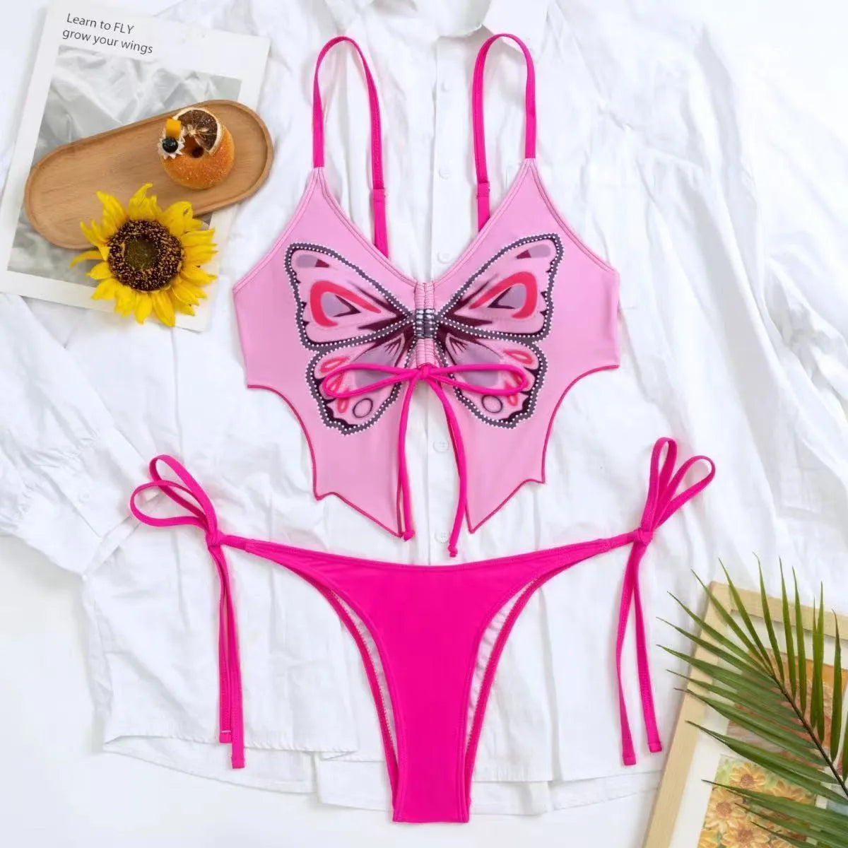 Women's purple bow ins style split bikini set with sleeveless top and briefs for swimming.