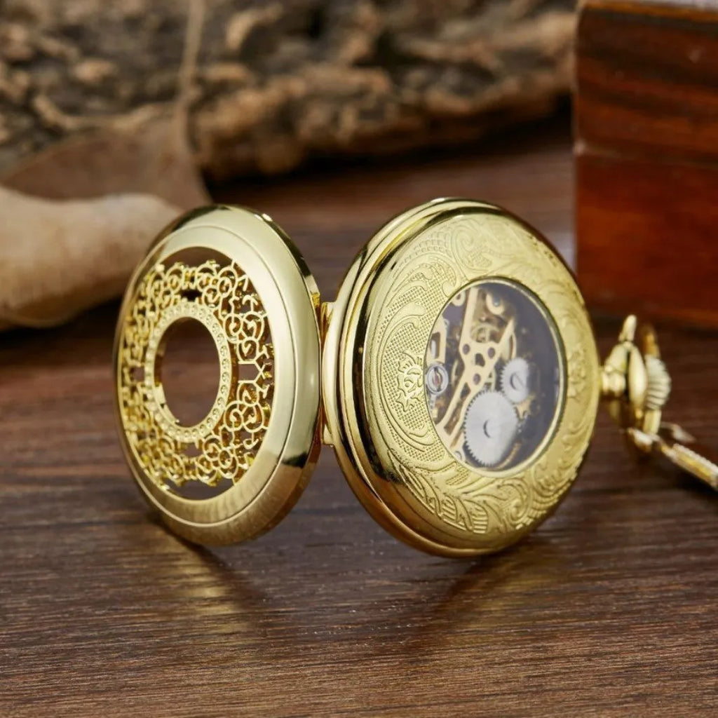 Retro hollow floral print mechanical pocket watch with transparent case back in gold colour.