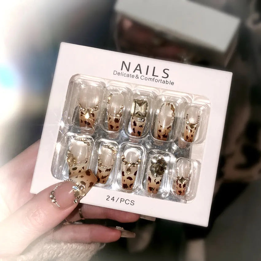 Leopard print plastic wearable nail armour set with advanced flash finish on women's hands