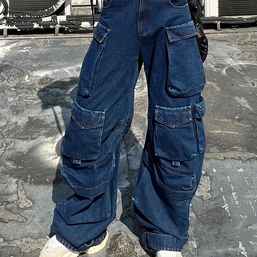 Dark blue distressed women's jeans with a high waist, wide legs, and multiple pockets on a mannequin.