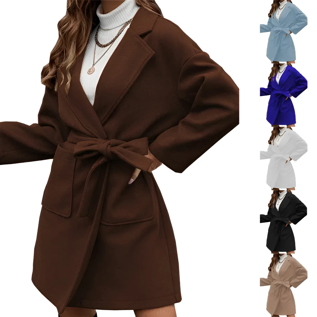 Long sleeve loose fit coat with lapel, buttons, and a belt in thick polyester fabric.