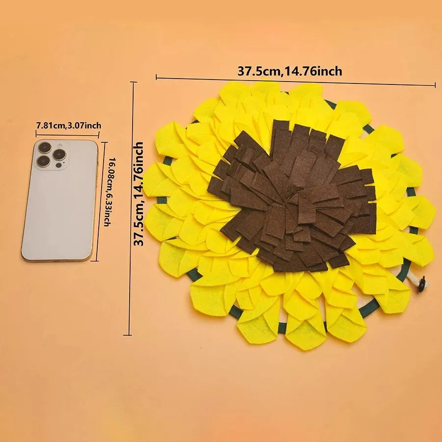 Yellow sunflower-shaped dog snuffle mat with fleece texture and a hanging rope buckle.