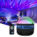 Fantasy Northern Lights projection star light with geometric PVC shade on a shelf