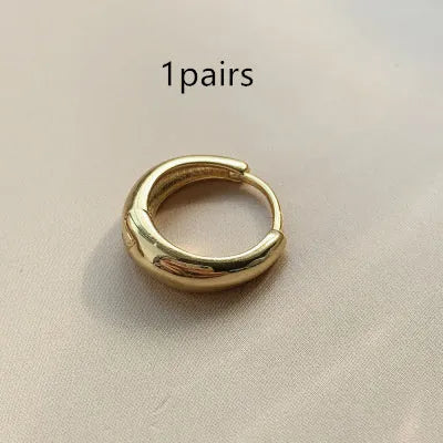Women's gold and silver water drop earrings in geometric minimalist design with three size options