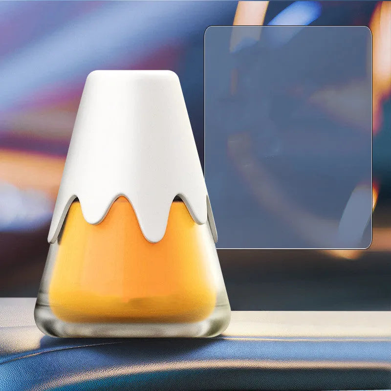 Snow Mountain Cup car air freshener in glass paste case showing four colour and scent options.