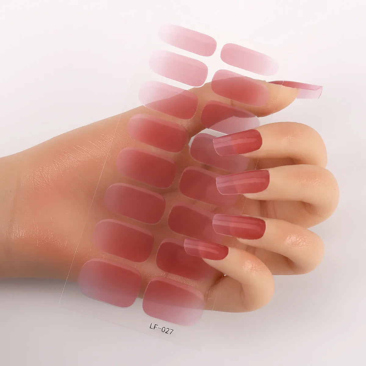Set of 16 solid colour full nail art stickers showing patterns like cross, rose, tulip, and cartoon designs.