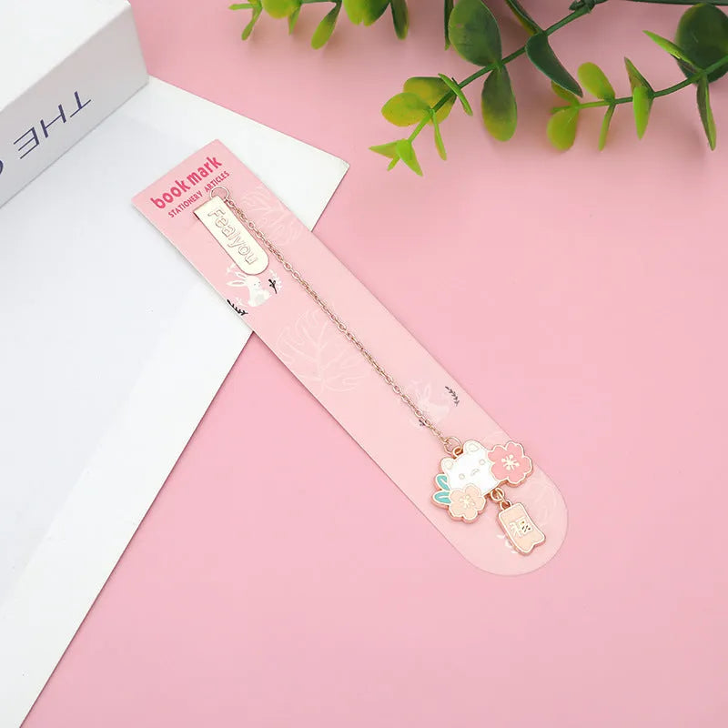Creative cartoon metal pendant bookmark holder with cherry cat design.