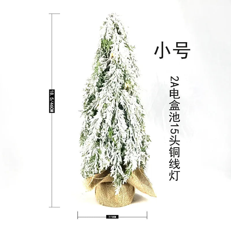 Small 24-inch white Christmas tree with lights and snow-covered branches for desktop decoration