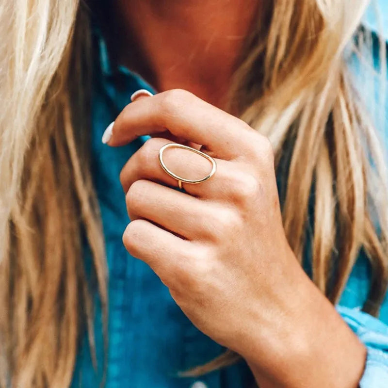 Women's geometric copper ring with zircon inlay in rose gold finish on white background