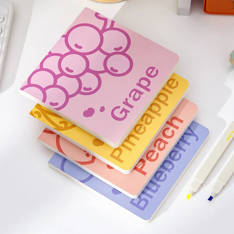 Square fruit design notebook showing embossed pineapple, blueberry, grape, and peach cover options.