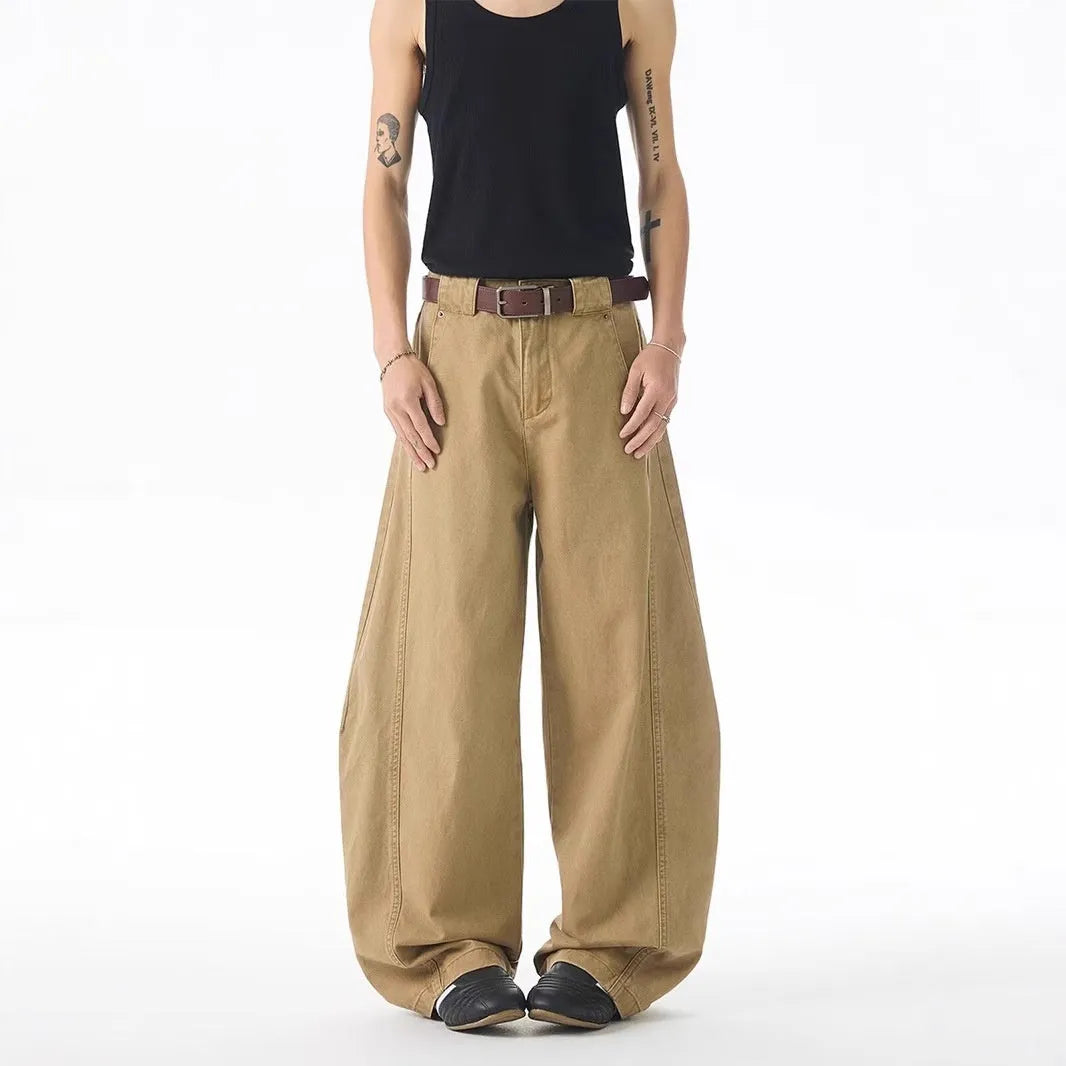 Brown loose fit straight leg men's jeans with a button fly on a mid waist.