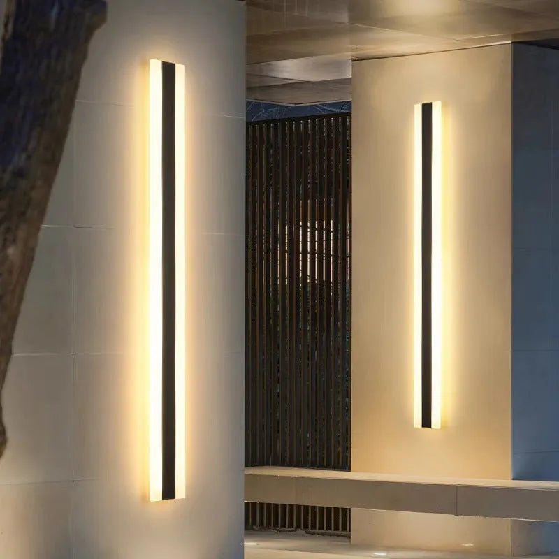 150cm long straight outdoor LED wall lamp with black wrought iron shell and warm white light.