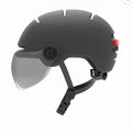 Cycling helmet with integrated rear LED brake light in M and L sizes for adult cyclists