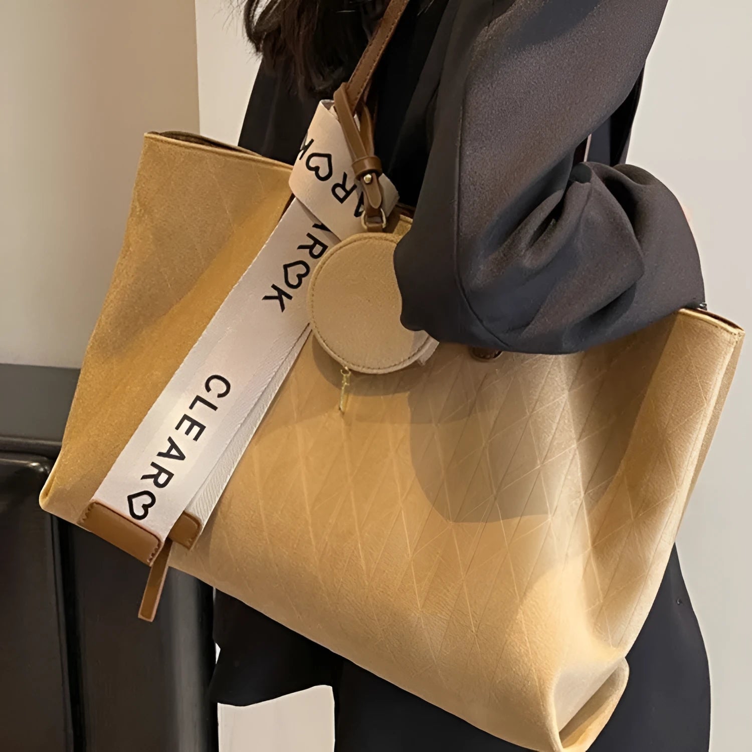 Large casual tote bag with shoulder strap in horizontal square shape with zippered internal compartment