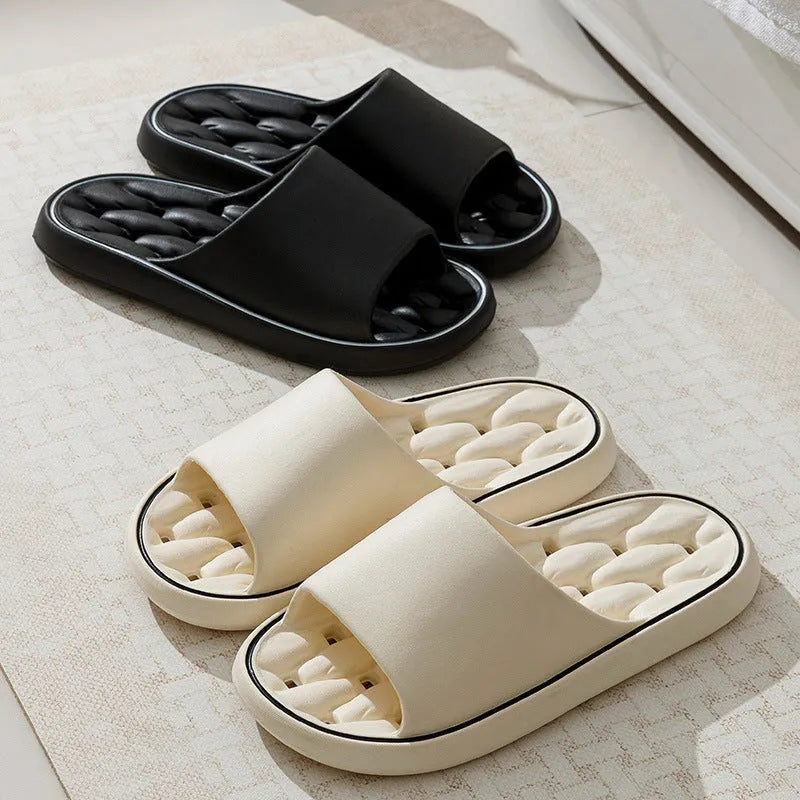 Non-slip EVA bathroom slippers with thick sole and hollow upper in grey, side view