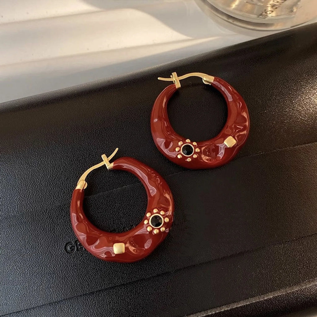 Hong Kong style retro ear studs with dripping oil finish and rhinestone inlay in black and red colours