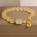 Women's citrine crystal bracelet with rhinestone decorative details showing natural yellow colour