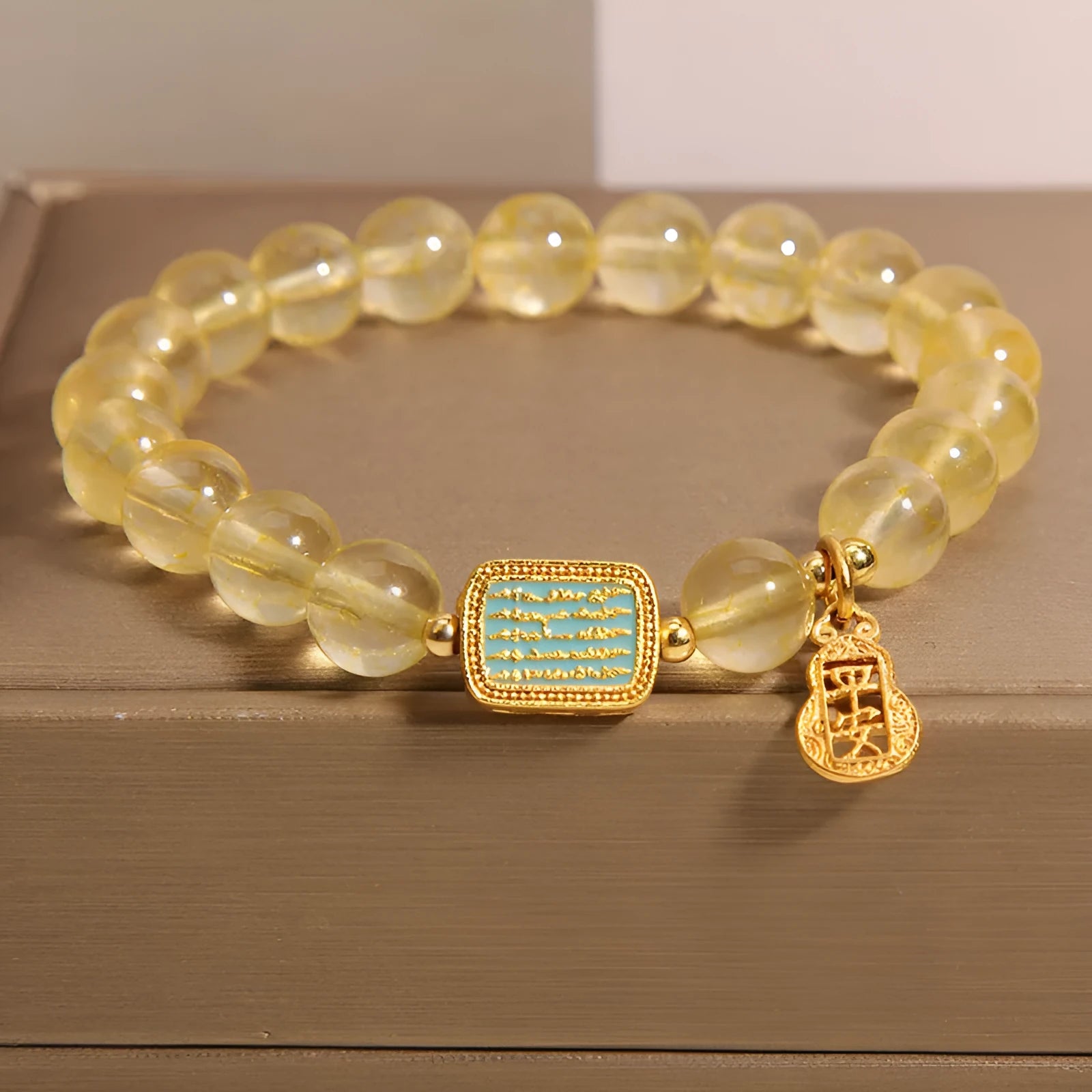 Women's citrine crystal bracelet with rhinestone decorative details showing natural yellow colour