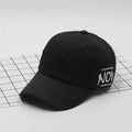Cotton baseball cap with letter embroidery, curved brim, dome top, adjustable size, in green colour.