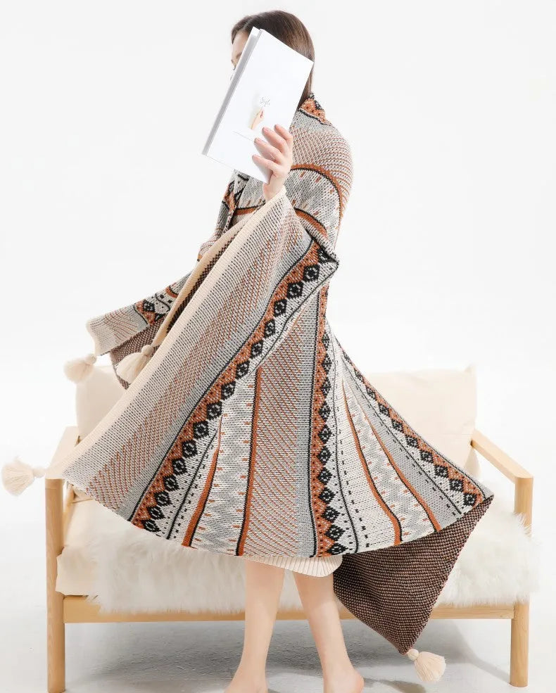 Acrylic sofa blanket with tassel fringe in geometric pattern, showing 130 cm width measurement