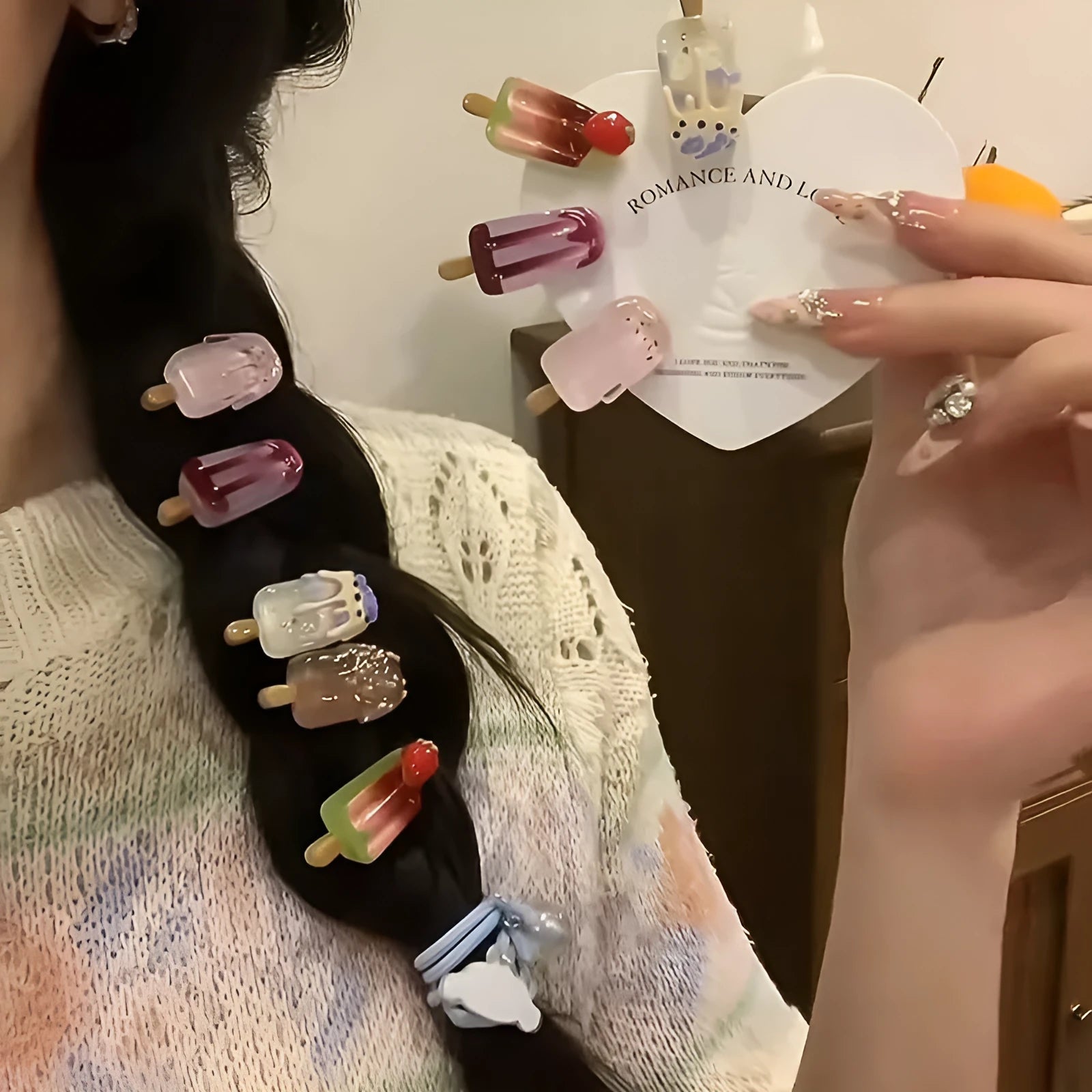 Close-up of a handmade resin hair barrette with a cute cartoon ice cream design in a choice of colours.