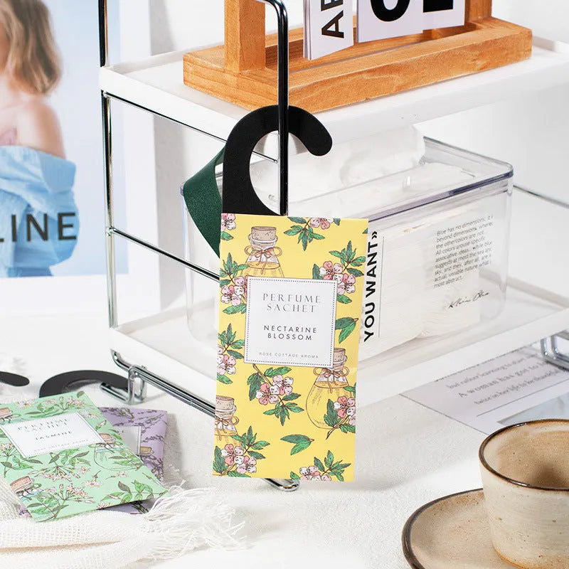 Five 30g lavender and rose scented wardrobe sachets on a shelf, each measuring 21x8cm