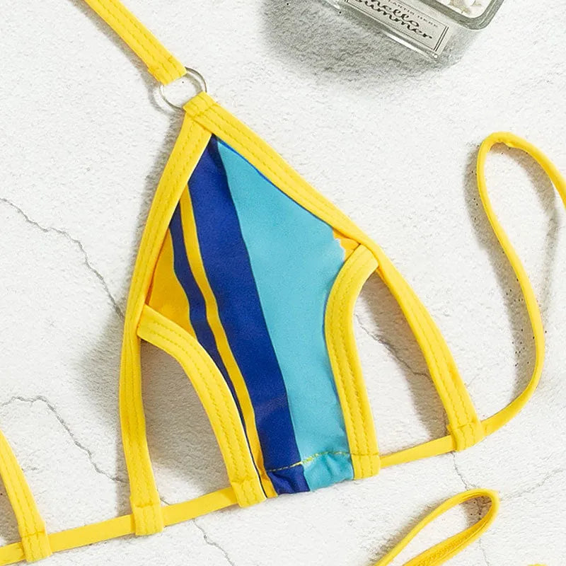 Yellow women's split swimsuit set showing sleeveless top with neck-hanging style and high-waisted bikini shorts.