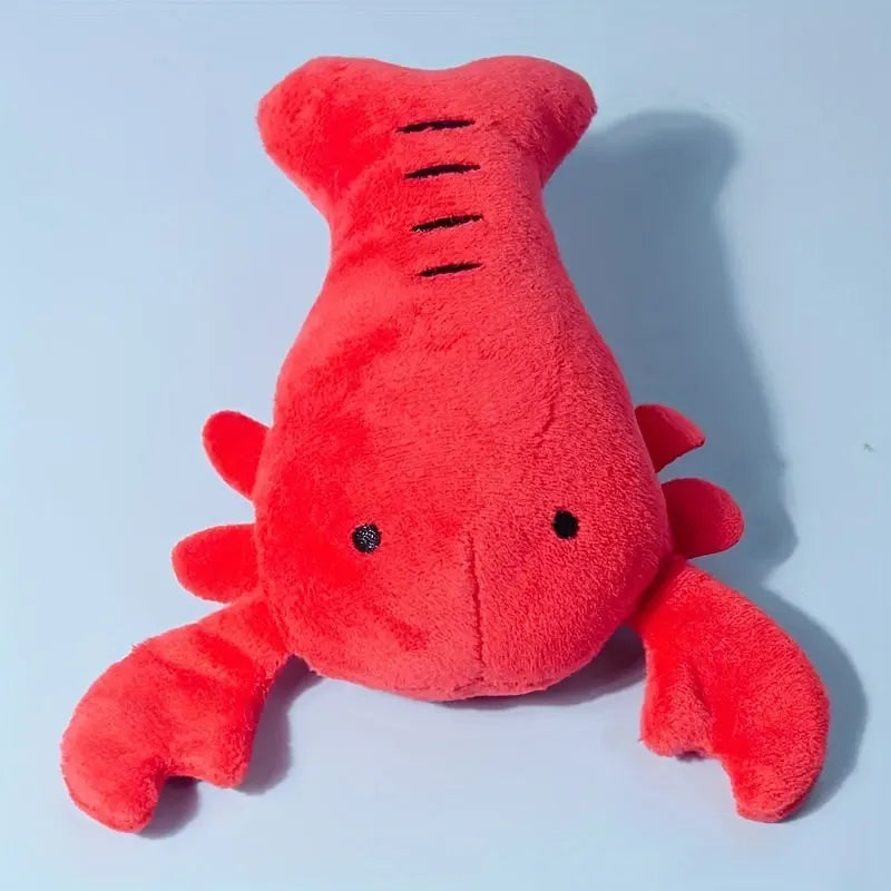 Red plush lobster-shaped squeaky dog toy for small and medium breeds.