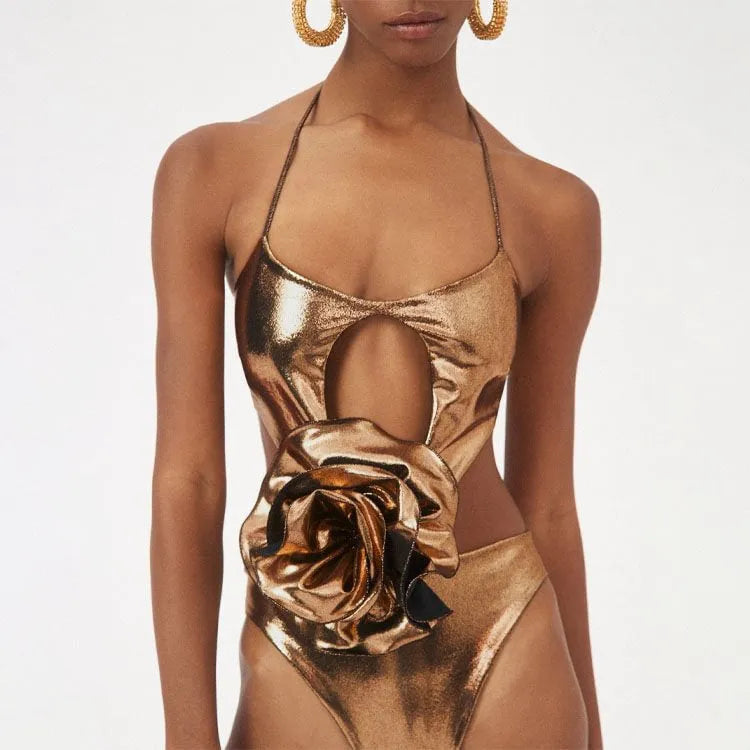 Gold coloured handmade one-piece swimsuit with a halter neckline and hollow-out design.