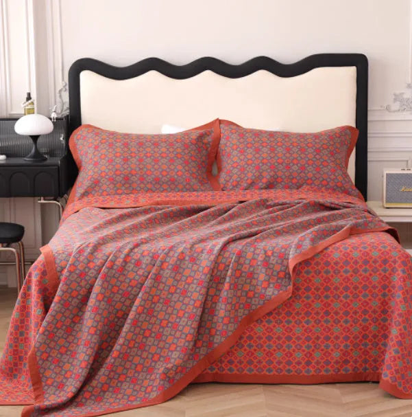 Cotton gauze bed blanket set with floral patterns showing blanket and two pillowcases
