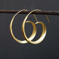 Gold alloy ear studs with round spiral leaf geometric design for women