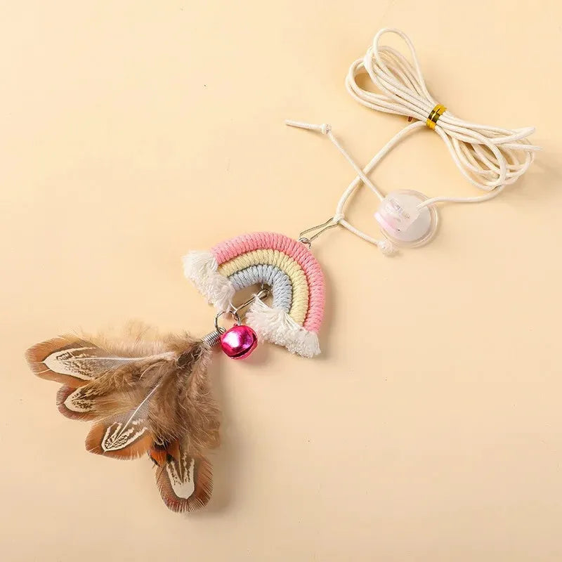 Cat door swing toy with colourful feathers on elastic cord attached by sticky buckle clamp