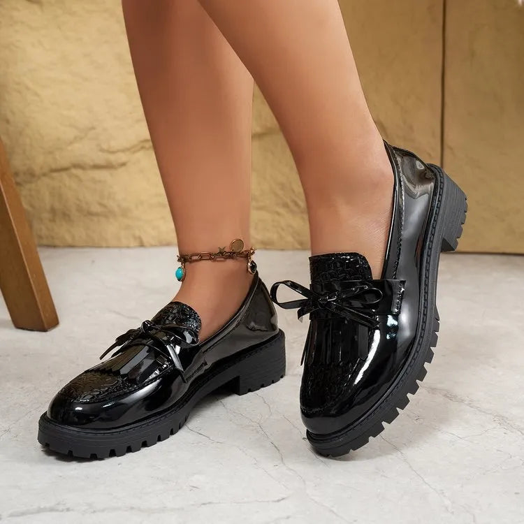 Women's brown loafers with decorative bow on artificial PU leather upper