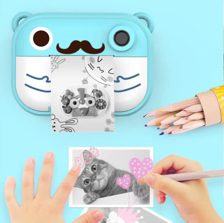 Blue HD digital camera with 2.4-inch screen alongside printing paper and accessories