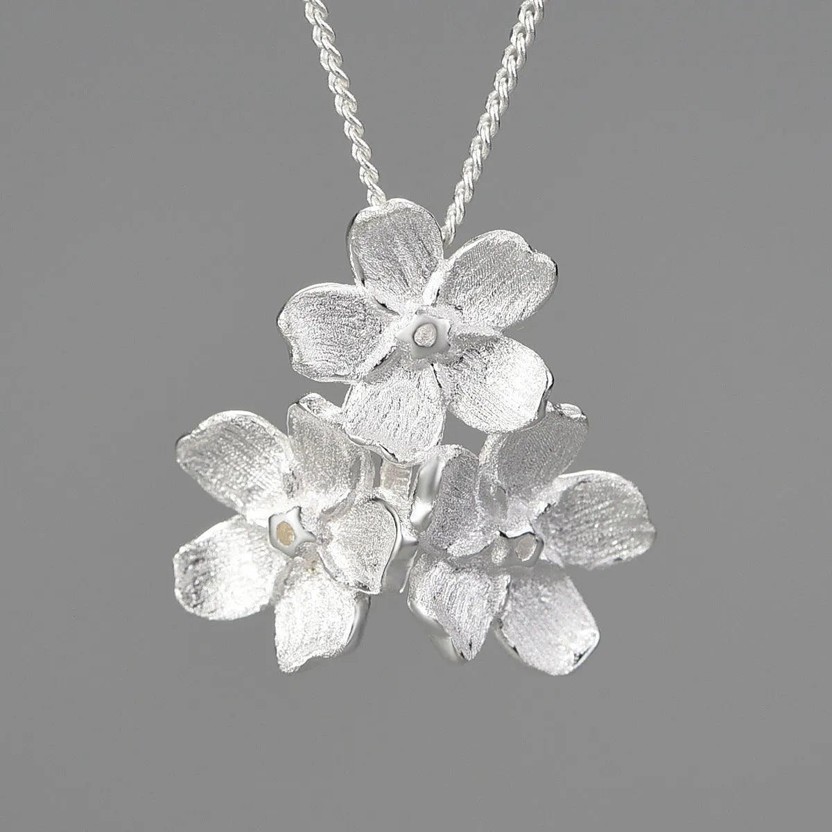 Sterling silver forget-me-not flower pendant in pastoral style with electroplated finish
