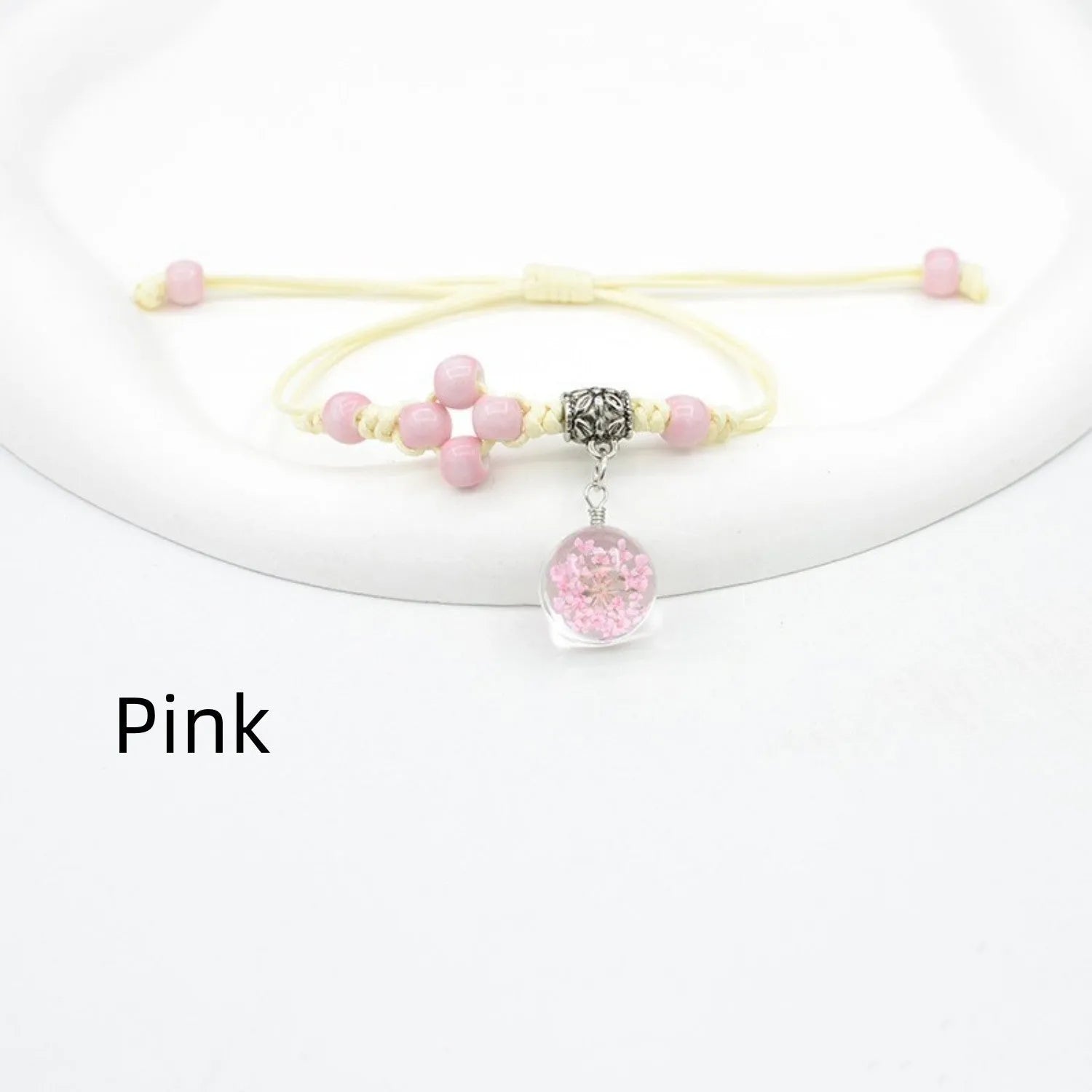 Hand-woven glass bracelet with 1.4cm beads containing real dried flowers in various colours