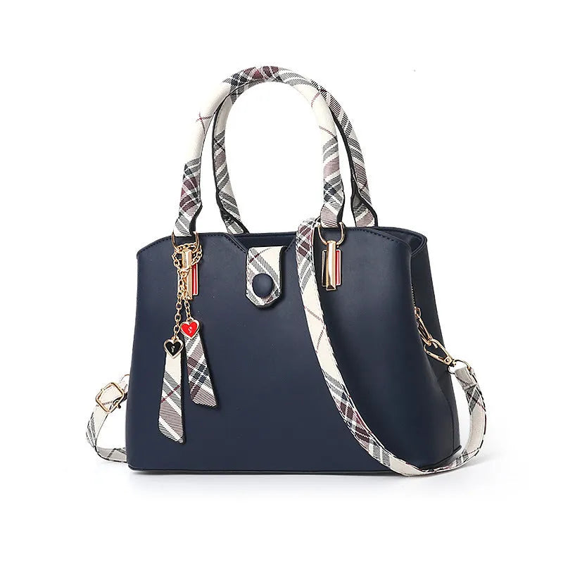 Large-capacity ladies PU Boston handbag with zipper and metal trim, medium size, available in multiple colours