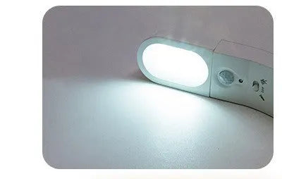 USB human body induction night light with light control, black colour, warm style LED lamp on bedside table