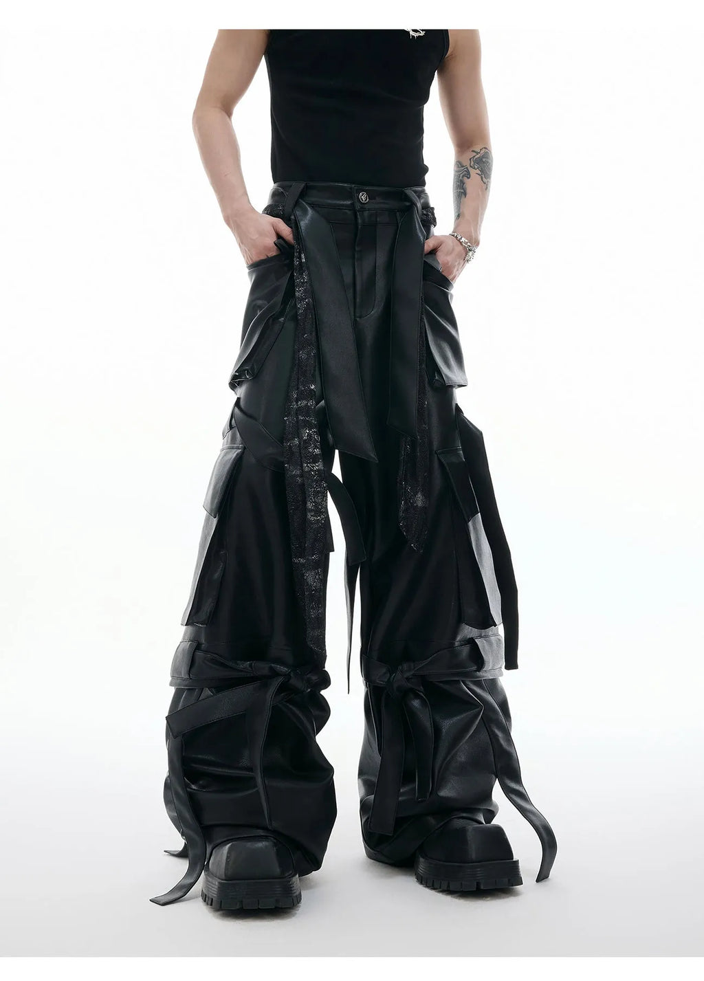 Black loose fit retro pants with multiple pockets, quilted stitching details and ribbon trim