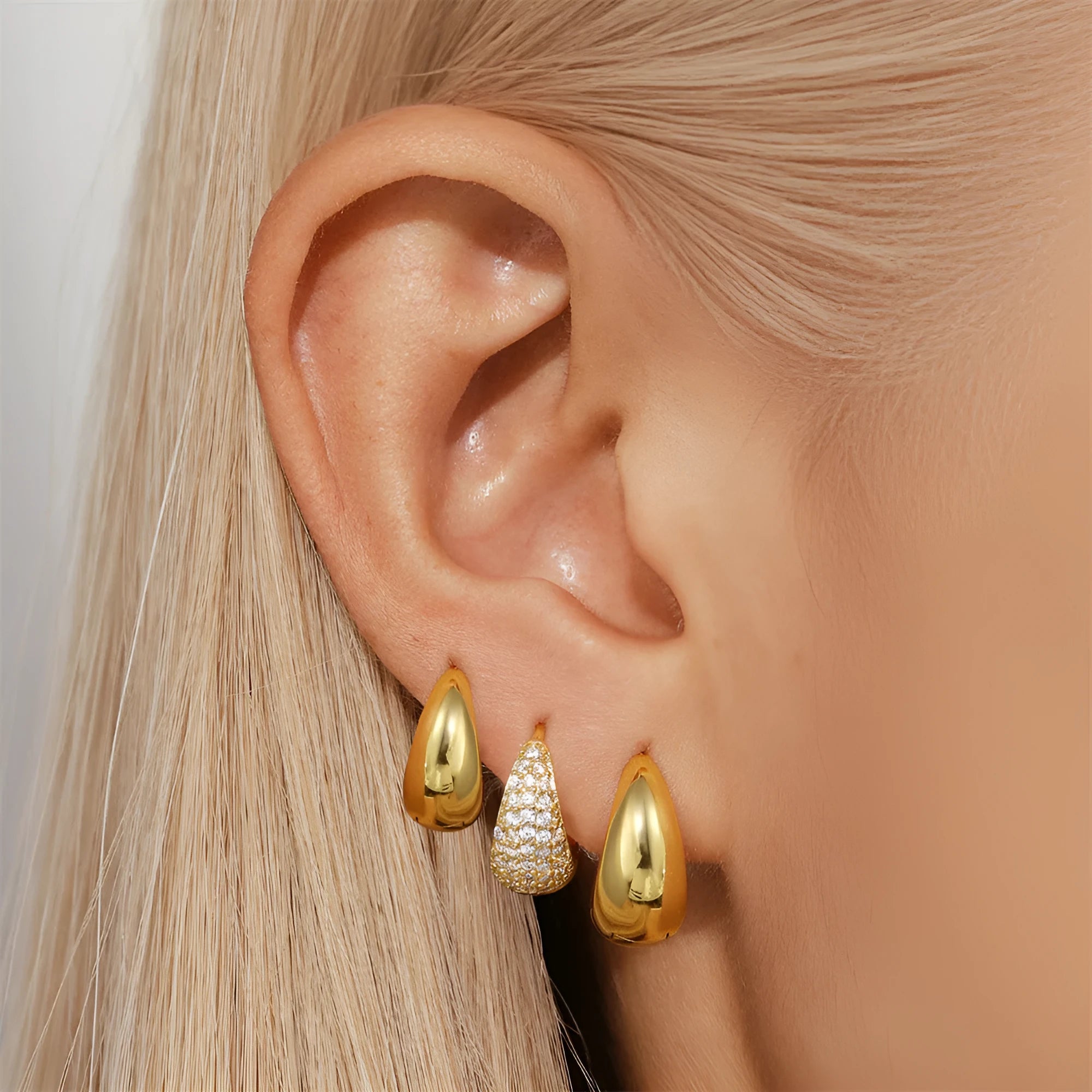 Golden brass diamond earclip earrings with geometric round design and butterfly backings