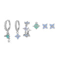 Flower-shaped stud earrings with zircon crystal centres in gold and silver colour options