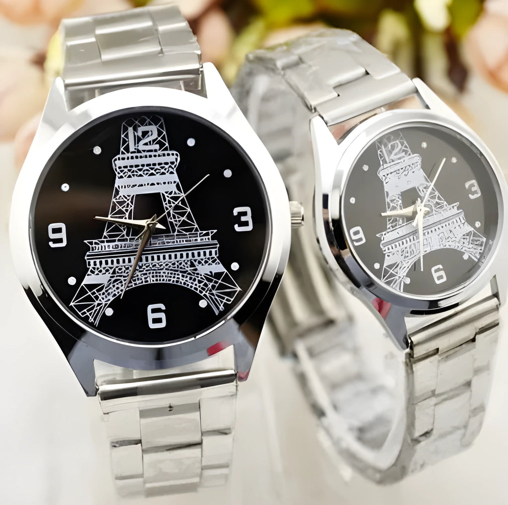 Round stainless steel watch with engraved Eiffel Tower design and Roman numeral markers