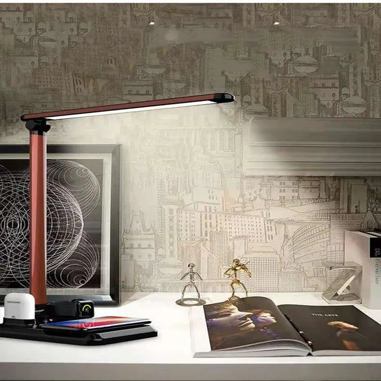 X-1 4-in-1 multi-function LED desk lamp in black or white with wireless charging pad.