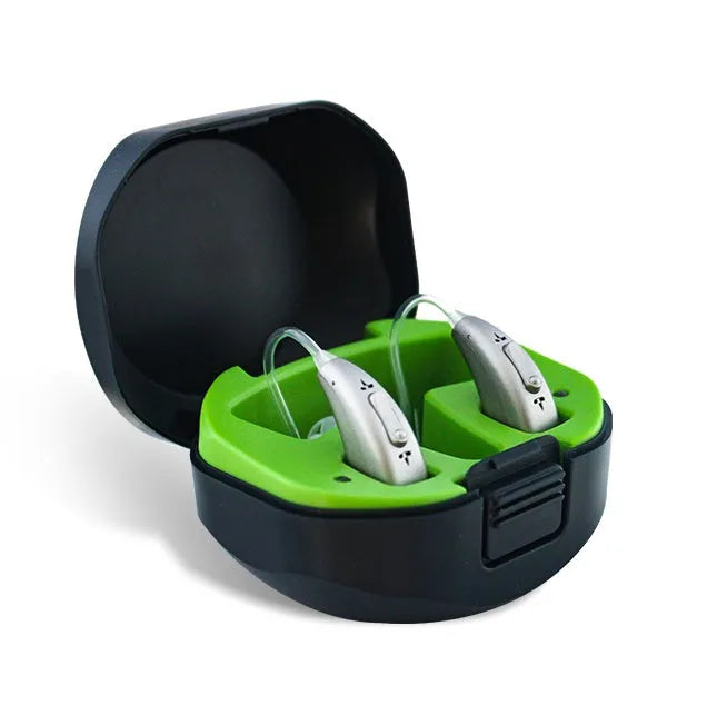 A small, wireless invisible hearing aid and its portable USB charging case.
