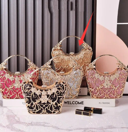 Silver hollow-out party clutch with shiny finish, flower motif, and bucket shape on a plain background