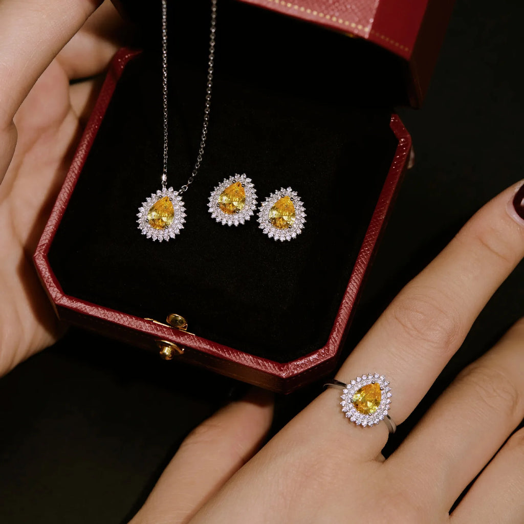 Sterling silver jewellery set with water droplet design necklace ring and earrings in gold finish