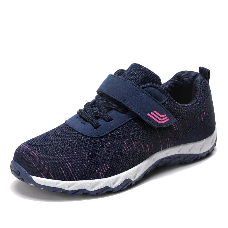 Women's gray purple low-top casual shoes with velcro strap and wedge heel.