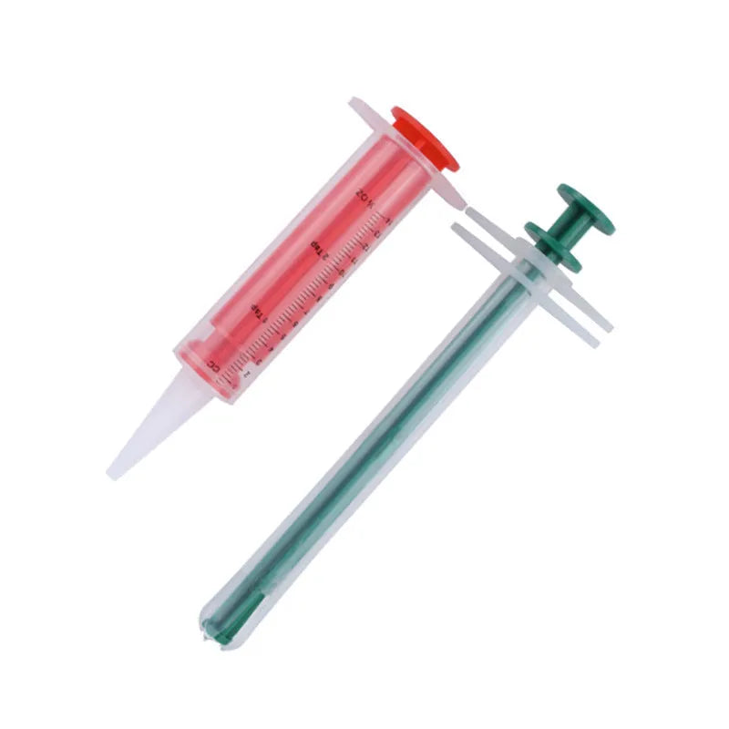 Two pet pill shooters with soft silicone tips for administering medication to cats and small dogs