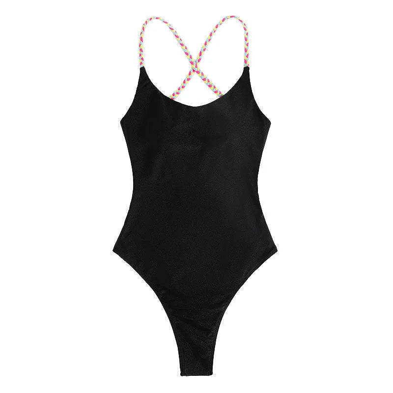 Black solid colour women's one-piece swimsuit with a backless, sleeveless design on a model.